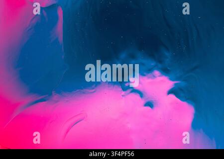 Abstract blue and pink fluid creating an active texture and gradient background Stock Photo