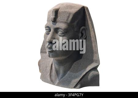 Ancient Egyptian pharaoh bust sculpture made of dark grey basalt or granite stone. The detailed head features a traditional royal nemes headdress with Stock Photo