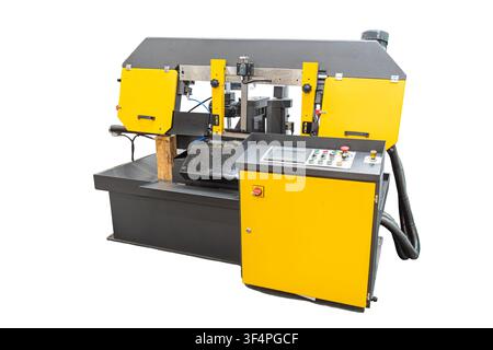 Heavy industrial horizontal band saw machine for metal cutting automation. Features a rugged steel frame with yellow safety covers, a built-in coolant Stock Photo