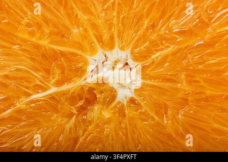 Macro of fresh orange flesh showing juicy citrus texture, natural patterns, and vibrant color, For food backgrounds, nutrition, and healthy lifestyle Stock Photo