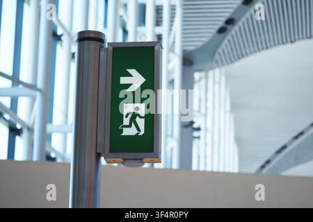 Sign showing exit path in a public building Stock Photo