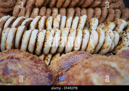 Bakery display of various breads and pastries at market Stock Photo