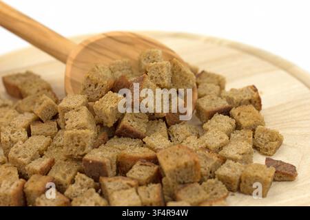Toasted bread cubes against white background Stock Photo