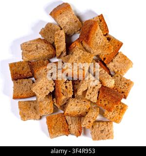 Toasted bread cubes against white background Stock Photo