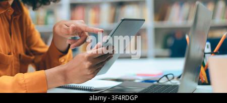 Focused Young Woman Using Tablet In Office, Working On Digital Projects, Business Concept Stock Photo