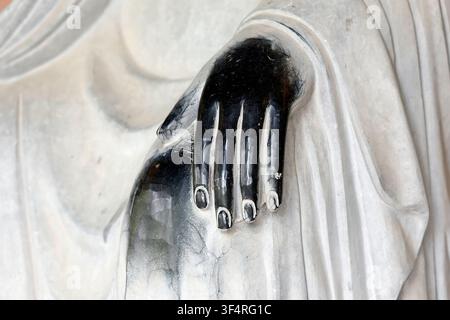 Bai Dinh Pagoda. Hall of the 500 Arhats. The white marble monks are enlightened disciples of the Buddha. A close-up of the marble, weathered by time a Stock Photo