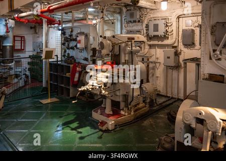 London, UK - 24 Jun 25: Shipboard workshop with machine tools and electrical equipment inside HMS Belfast museum ship in London, England. Stock Photo