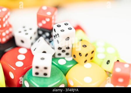 Scattered multicolored playing pieces used for tabletop games and probability learning Stock Photo