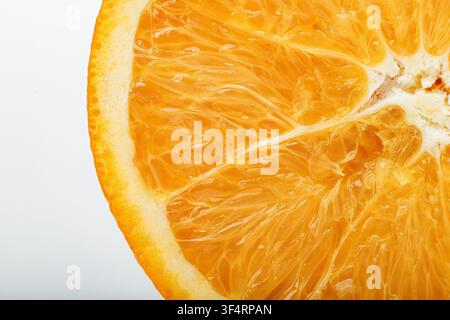 Macro of fresh orange flesh showing juicy citrus texture, natural patterns, and vibrant color, For food backgrounds, nutrition, and healthy lifestyle Stock Photo