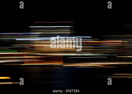 Horizontal light trails on dark background Stock Photo