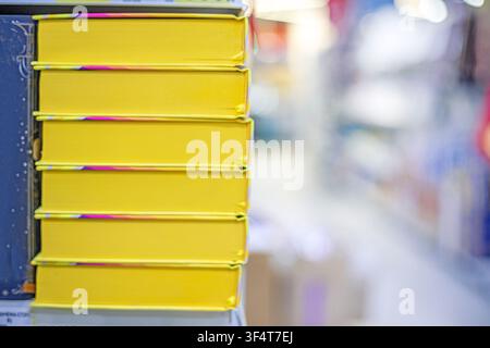Textbooks, books, and notebooks on shelves in the bookstore. Education and Intelligence Stock Photo