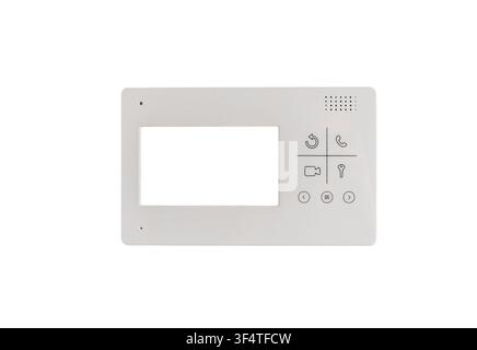 A white wall-mounted intercom panel with a small screen and control buttons is isolated on a plain background. The video doorphone device enables resi Stock Photo