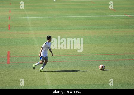 Japanese junior high school student playing soccer (13 years old) Stock Photo