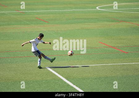 Japanese junior high school student playing soccer (13 years old) Stock Photo