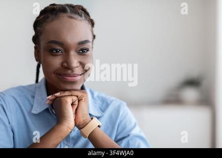 Closeup Portrait Of Pensive African American Woman With Glad Face Expression Stock Photo