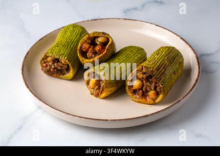 Traditional Turkish Sihil Mahsi Stuffed Zucchini with Minced Meat and Chickpeas Served on a Plate Stock Photo