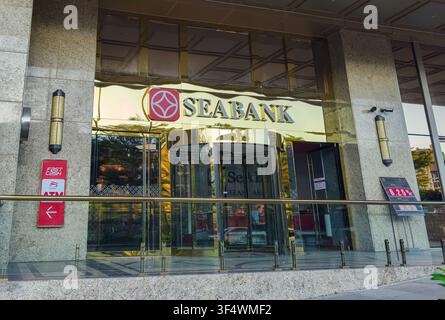 entrance of the BRG Tower in Hanoi, Vietnam, which houses a SeABank headquarters and features NABCO revolving doors Stock Photo