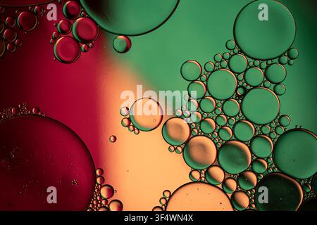 Oil and water creating abstract patterns with colorful bubbles and vibrant liquid textures Stock Photo