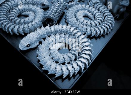 Art models printed on 3D printer. Different objects created on 3D printer from molten plastic. 3D printed different objects. Modern new modern additive progressive technologies. 3D printing technology Stock Photo