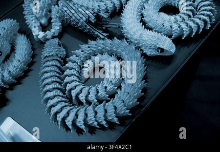 Art models printed on 3D printer. Different objects created on 3D printer from molten plastic. 3D printed different objects. Modern new modern additive progressive technologies. 3D printing technology Stock Photo