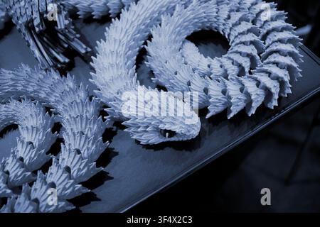 Art models printed on 3D printer. Different objects created on 3D printer from molten plastic. 3D printed different objects. Modern new modern additive progressive technologies. 3D printing technology Stock Photo