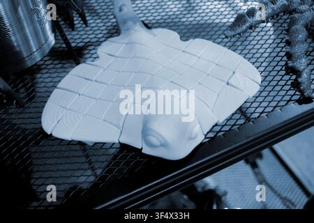 Art models printed on 3D printer. Different objects created on 3D printer from molten plastic. 3D printed different objects. Modern new modern additive progressive technologies. 3D printing technology Stock Photo