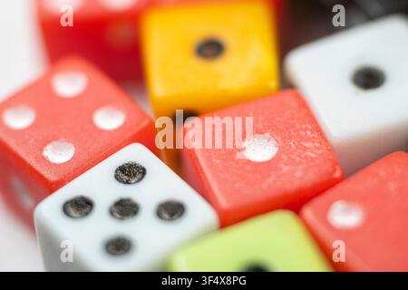 Detailed shot of old gambling dice highlighting the scratches and wear on the plastic surface Stock Photo