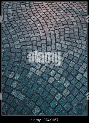 Old cobblestone road in Clermont-Ferrand (Auvergne), irregular alignment of the cobblestones Stock Photo