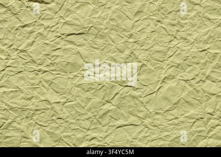 Crumpled olive green paper texture background with wrinkles for creative design Stock Photo