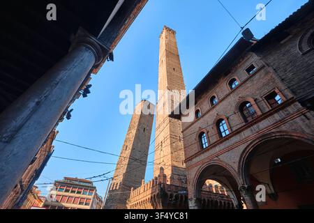 Bologna, Italy - May 2026: Low angle perspective view of Asinelli and Garisenda Two Towers with portico Stock Photo