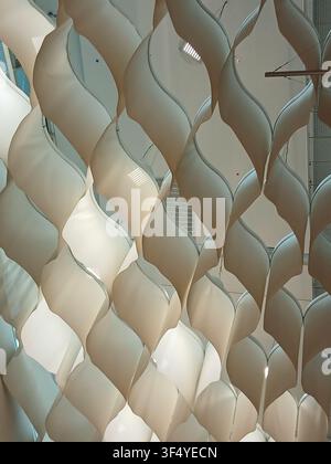 Abstract architectural background featuring a white geometric grid structure with cell pattern and shadow lines Stock Photo