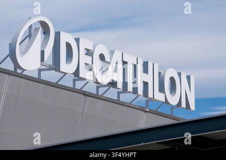 Grancia, Ticino, Switzerland - 15th June 2026: Low angle view of the white Decathlon 3D logo sign with orbit symbol mounted on top of the store buildi Stock Photo