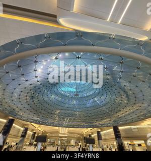 Abu Dhabi, United Arab Emirates - 30 July 2026: View of the intricate geometric ceiling structure at Zayed International Airport, featuring modern arc Stock Photo