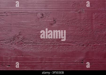 Red painted wooden plank texture background with visible wood grain and knots, Rustic  wood texture. Top view of painted wooden board background Stock Photo