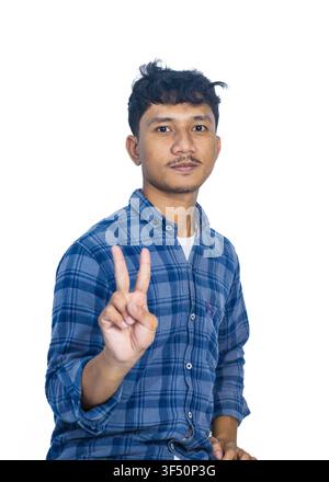Young Asian Man in Blue Plaid Shirt Showing Peace Sign Isolated on White Stock Photo