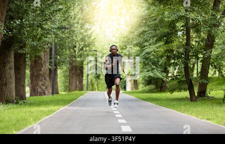 Athletic african man getting ready for marathon at park Stock Photo