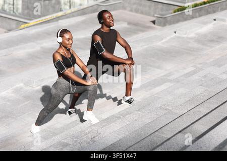 Sporty Lifestyle. Black Athlete Couple Training Together Outdoors In Urban Park Stock Photo