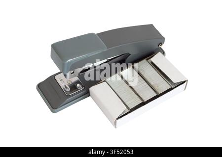 Stationery stapler with staples on a white background. A close-up of a modern stapler. Stock Photo