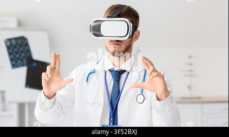 Male doctor wearing virtual reality headset and interacting with augmented reality in a modern medical office Stock Photo
