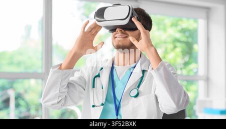 Male doctor wearing virtual reality headset, medical innovation and future healthcare technology Stock Photo
