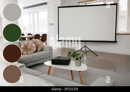 Modern office interior with a large blank projection screen, projector, and comfortable seating for presentations Stock Photo