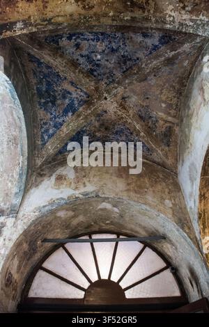 A vaulted ceiling in 18th century Santa Maria Draperis church, Istanbul, Turkiye. Gothic groin vault with diagonal ribs intersecting at the centre. Stock Photo