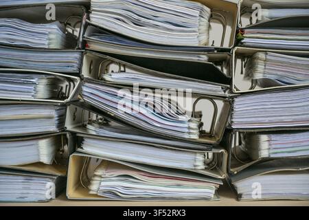Stacks of ring binders with many documents as full frame background, business concept for excessive bureaucracy, record keeping, accounting and work o Stock Photo
