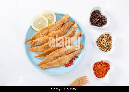 Pan Fried Tongue Sole Fish Fillets Served with Lemon Slices Stock Photo