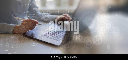 Robotic Process Automation system for business workflow optimization with hand interaction on laptop Stock Photo