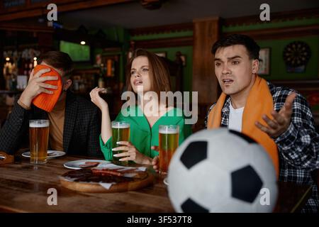 Viewers display range of intense emotions reacting to umpire decision on television Stock Photo