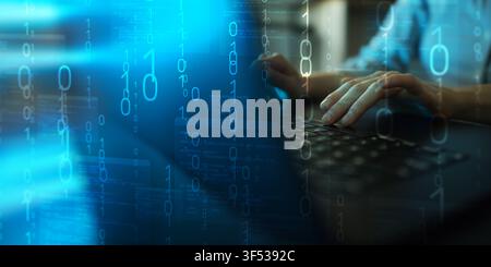 Software programming concept for IT development with hands typing on a keyboard and digital binary code Stock Photo