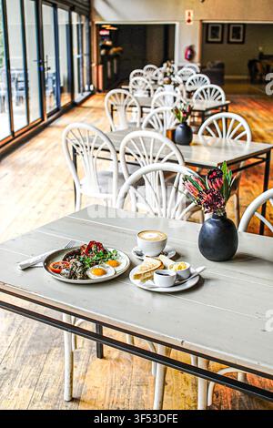 Full breakfast meal served on a table in a rustic cafe Stock Photo