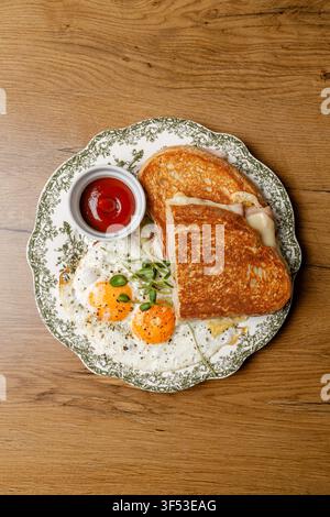 Fried egg breakfast with toast on a vintage plate. Stock Photo