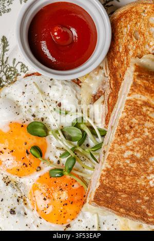Texture fried egg breakfast with toast on a vintage plate. Stock Photo